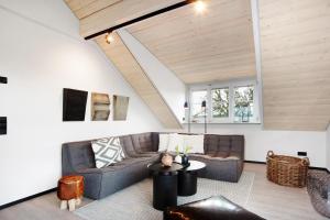 a living room with a couch and a table at Appartement in Wangen im Allgäu