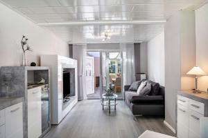 a living room with a couch and a table at Ferienhaus Ihme in Sande