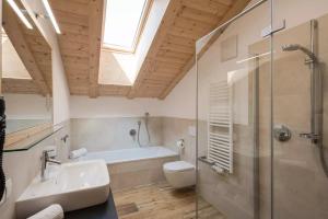 a bathroom with a sink and a toilet and a shower at Natur Suite Edelweisshof App Georg in Chiusa +21 photos