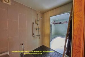 a bathroom with a shower with a glass door at Gite Escale Bien Etre à Biscarrosse in Biscarrosse +19 photos