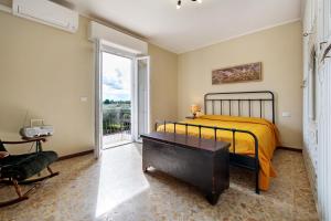 a bedroom with a bed and a window at Casa Solarolo in Montinelle