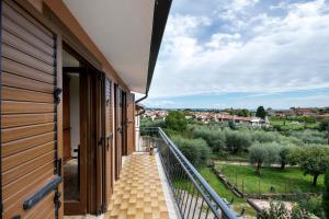 a balcony with stairs and a view of trees at Casa Solarolo in Montinelle