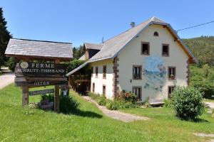 a building with a sign in front of it at Les Hirondelles in Orbey +18 photos