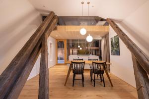 a kitchen and dining room with a table and chairs at Lippenhof - Unter der Linde in Unterkirnach