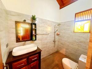 a bathroom with a sink and a shower at Anu villa Bentota in Bentota