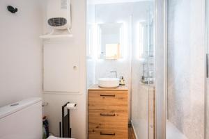 a bathroom with a sink and a shower at Appartement Les Menuires in Les Menuires +12 photos