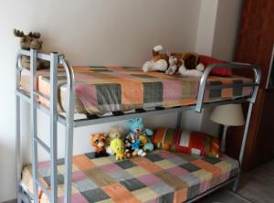A bed or beds in a room at Bellavista wonderful lake view