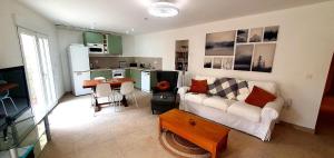 a living room with a couch and a table at El Jardin Secreto in Oria