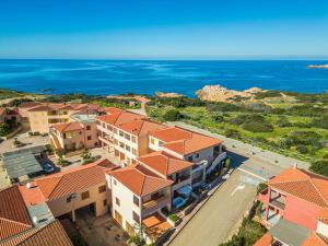 an aerial view of a resort with the ocean at A.I.R. Isola Rossa Borgo di Mare in Isola Rossa