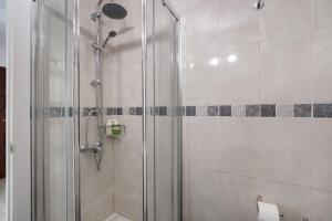 a shower with a glass door in a bathroom at Loft Guanapay 2 in Los Cristianos