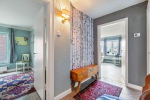 a hallway with a door leading to a living room at Bungalow vor Sylt in Klanxbüll