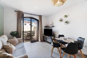 a living room with a couch and a table at Casa Tagoro Dream in Costa Del Silencio