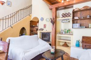 a living room with a bed and a fireplace at Cala Serena Beach 1 in Felanitx