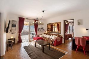 a living room with a couch and a table at Finca Fani 1 in Agüimes