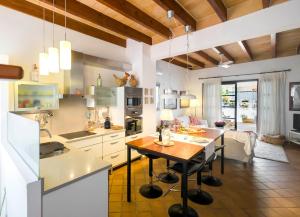 a kitchen with a table and a dining room at Sa Caseta in Felanitx