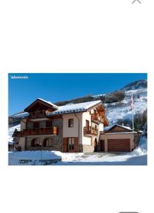 a house in the snow with at Chalet Azureva Sauna, Jacuzzi, Spa in Levassaix