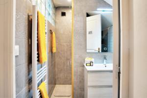 a small bathroom with a sink and a mirror at Chambre D'hotes Les Tuilières in Mouleydier +26 photos