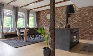 a kitchen and dining room with a table and chairs at Fewo einzigartige Aussicht im Harz in Walkenried