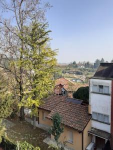 a view of a roof of a house and a building at La Casa di Aldo 15 minuti da Torino in Pecetto