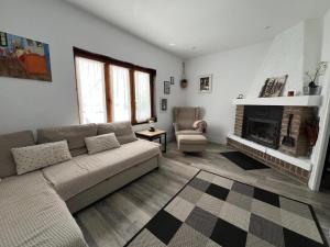 a living room with a couch and a fireplace at Amets in Yesa