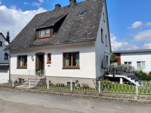a white house with a gray roof at Marisa's Sauerlandträumchen in Brilon