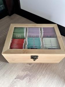 a wooden box filled with different colored plates at Schwarzwald Martini in Sasbachwalden