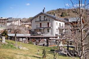 a large white house on top of a hill at Verger Plein Soleil in Saint-Pierre