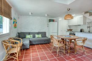 a living room with a couch and a table and chairs at Old Side Duplex Platja d Aro in Platja d'Aro +17 photos