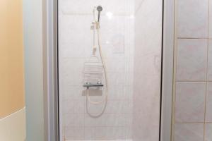 a shower with a shower head in a bathroom at Maison Avec Vue Sur Le Ventoux in Faucon +15 photos