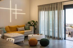 a living room with a couch and a table at Dias Guest House in Rethymno