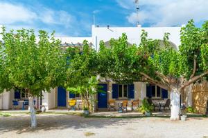 a house with trees in front of it at Perasma Studio 6 in Kipri