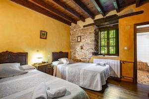 Tempat tidur dalam kamar di La Valleja