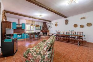 a living room with a couch and a table at Casale- Il Giglio Rosa in Sorso +34 photos