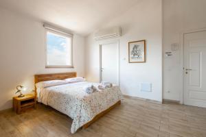 a bedroom with a bed and a window at Albergo Pietriccio Rosso in Manciano +108 photos