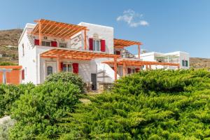 a house on a hill with trees at Anemologio 201 Tinos in Agios Ioannis +11 photos