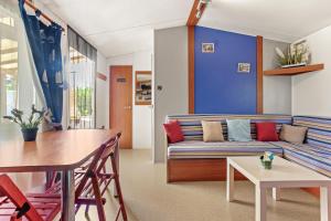a living room with a couch and a table at Marinière in Sainte-Croix-de-Verdon