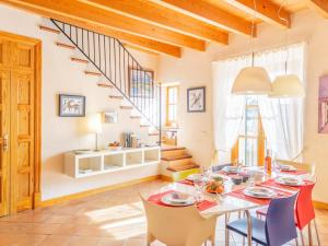 a dining room with a table and chairs and a staircase at Palma Townhouse Near the Beach in Palma de Mallorca +23 photos