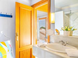 a bathroom with a sink and a mirror at Palma Townhouse Near the Beach in Palma de Mallorca