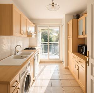a kitchen with a sink and a dishwasher at Appartement De Standing Avignon in Avignon