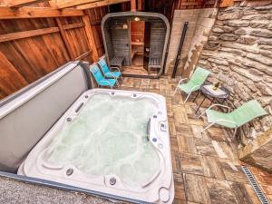 an overhead view of a hot tub on a patio at Holiday Home Marika by Interhome in Černý Dŭl