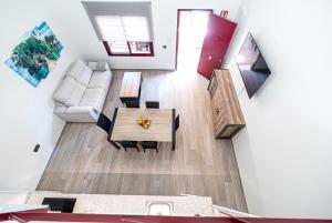 a living room with a table and a couch at Ocean Suites A7 in Isla Cristina