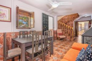 a dining room with a table and chairs at Casa Roque in Monachil