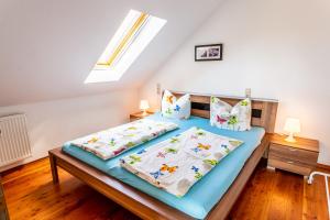 a bedroom with a bed in a attic at Elstar in Stockach