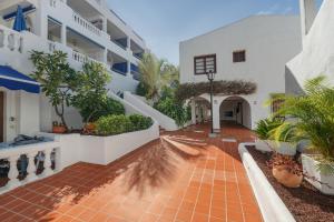 an external view of a building with a courtyard at Charming one bedroom Los Cristianos in Arona