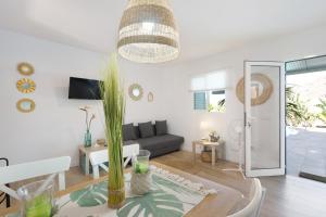 a living room with a couch and a table at Villa Tino- Casa D in Los Llanos de Aridane