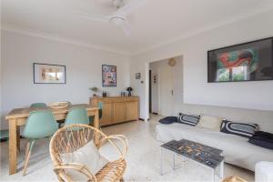 a living room with a couch and a table at Maison à Argelès in Argelès-sur-Mer