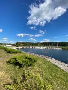 a view of a river with boats in the water at Mazurska Oaza in Pisz