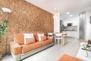 a living room with a couch and a table at Casa Almi Las Palmas in Las Palmas de Gran Canaria