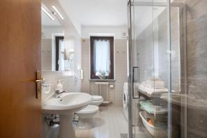 a bathroom with a sink and a toilet and a shower at Verger Plein Soleil in Saint-Pierre +62 photos