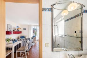 a bathroom with a shower and a table and chairs at Moewentraum in Malchow +45 photos